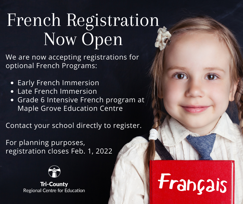 Young student holds French Textbook