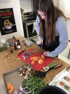 Student cooking sheet pan recipe